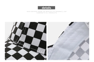 Detailed macro view showing checkerboard fabric texture and fine stitching on the baseball cap
