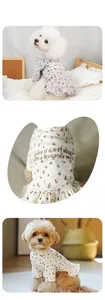 Detail of floral pet dress showing delicate pattern and ruffled hem for small dogs
