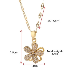 Detailed view of a gold flower necklace with zircon inlay and 1.9cm pendant size