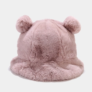 Close-up of fluffy faux rabbit fur texture on a pink bucket hat with cute bear ears