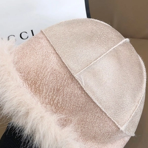 Pink plush Mongolian style fisherman hat with faux fur trim for winter warmth