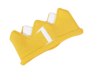 Close-up of yellow knitted baby crown birthday hat with white number one embroidery