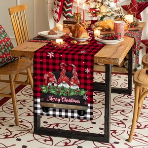 Red and black plaid Christmas table runner featuring gnomes and vintage truck decor