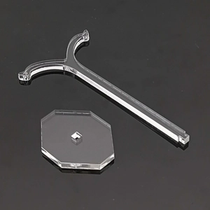 Detail view of transparent acrylic earring display stand with T-bar and octagonal base