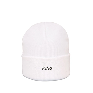Detail of white knit beanie featuring black embroidered KING lettering on folded cuff