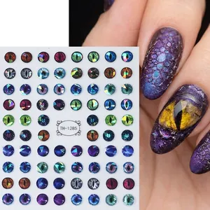 3D dragon eye nail stickers with realistic pupil patterns and colorful scale texture