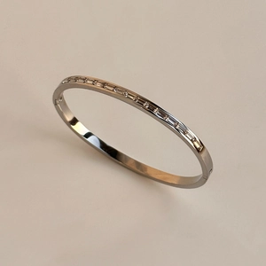 Modern stainless steel bangle with rectangular clear cubic zirconia stones in silver tone