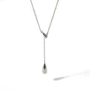 Detail of silver water drop pendant necklace with a minimalist Y-chain design