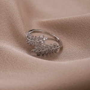 Silver leaf open ring with cubic zirconia on satin, elegant adjustable tree branch jewelry