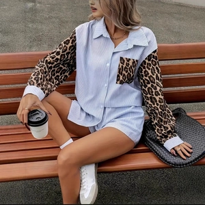 Detailed view of the striped shirt sleeve with leopard print cuff and matching shorts