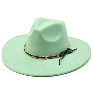 Detail of mint green wide brim fedora hat featuring golden chain and black leather bow