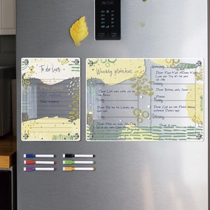 Macro view of magnetic acrylic weekly planner and to-do list with colored markers on fridge