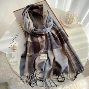 Classic plaid tassel scarf in brown and blue colors with soft cashmere-like texture