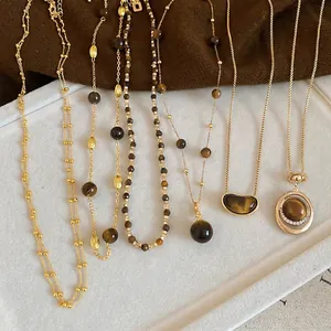 Retro tiger eye stone pendant necklace with layered gold beads for autumn winter styles