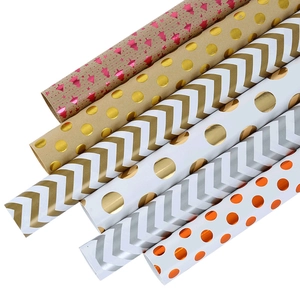 6 rolls of double-sided holiday gift wrapping paper with metallic gold stripes and dots