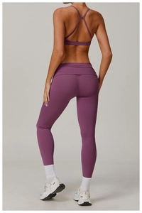 Rear view of purple crossover sports bra and high-waisted yoga pants for fitness