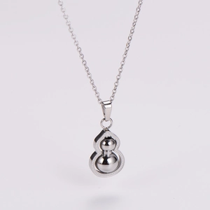 Detail view of a silver stainless steel gourd pendant with a polished mirror finish