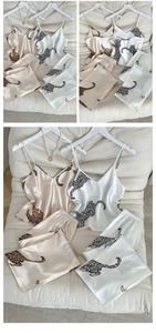 Detailed view of satin leopard print pajamas with V-neck camisole and matching pants
