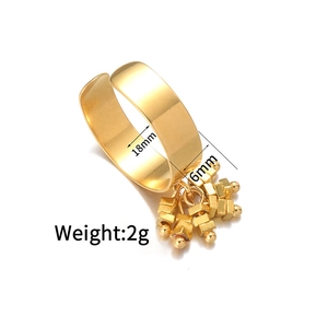 Detail shot of a gold open ring with colorful geometric charms and 18mm inner diameter