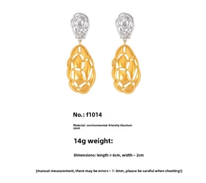 Detail view of irregular two-tone oval earrings with size and material specifications