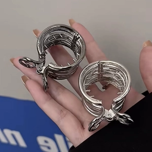 Minimalist silver metal hair claw clip with hollow round cage design for high ponytail