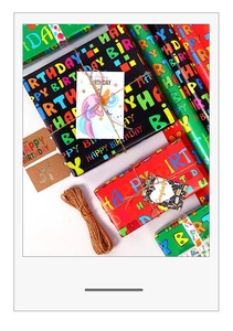 Birthday gift wrap set with colorful Happy Birthday letters, gift cards and hemp rope
