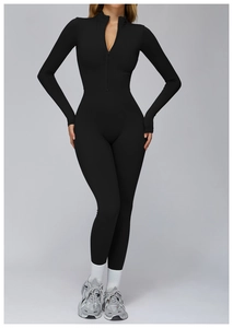 Detail of long sleeve black jumpsuit featuring high collar half-zipper and thumbhole cuffs