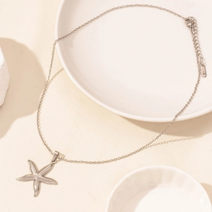 Silver starfish pendant necklace with detailed texture and adjustable lobster clasp chain