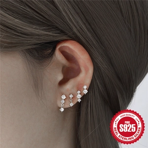 925 sterling silver stud earring set with sparkling cubic zirconia on female model