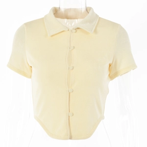 Detail of light yellow short-sleeved polo cardigan with curved hem and buttons