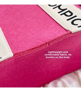 Close-up of pink felt tote bag featuring durable fabric and MPIC lettered cream handle