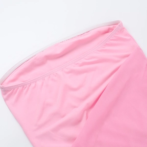 Detailed macro shot of pink knitted fabric showing refined stitching and elastic texture