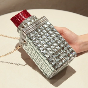 Sparkling crystal evening clutch bag in wine bottle shape with red and silver rhinestones
