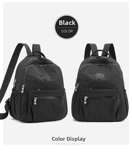 Detail of black scratch-resistant nylon backpack with multiple zipper pockets and side mesh bags