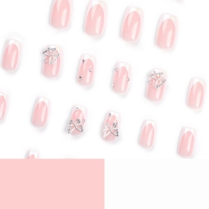 Pink French manicure press-on nails with silver glitter butterfly and pearl accents