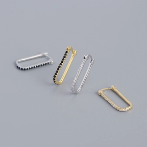 Detail of S925 sterling silver geometric oval earrings with gold and silver finishes