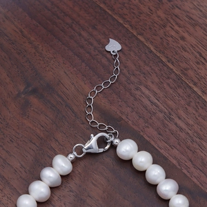 S925 sterling silver lobster clasp with heart charm on a white pearl necklace