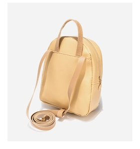 Detail view of beige PU leather mini backpack with embroidery and adjustable straps