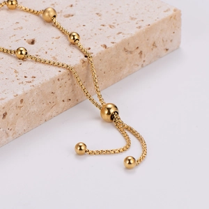 Adjustable minimalist gold beaded stainless steel bracelet with sliding drawstring closure