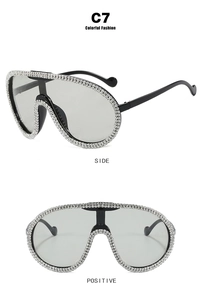 Detailed front and side views of oversized shield sunglasses with rhinestone crystals