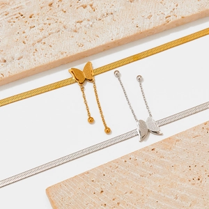 Elegant butterfly tassel anklets in gold and silver steel on marble stones