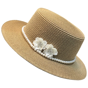 French straw sun hat with white pearl beads and floral accents on flat top brim