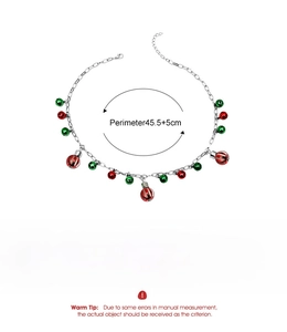 Detailed silver chain necklace with red and green bells, including size and weight specs