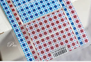 Macro detail of TS-387 ultra-thin 5D nail stickers with Scottish plaid patterns