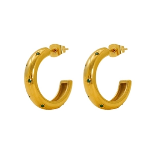 Golden stainless steel hoop earrings with star-set green zircon on a white background