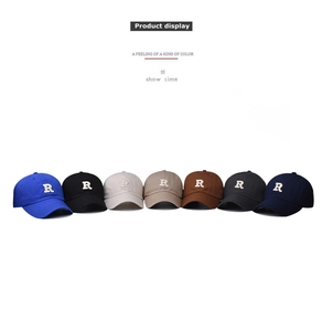 Detail display of cotton baseball caps with embroidered R logo in seven various colors
