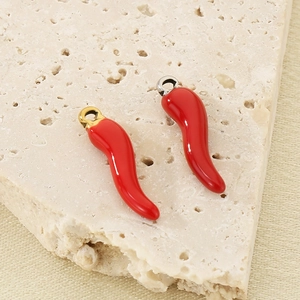 Detailed close-up of 3D red chili pepper earring charms with smooth glossy finish