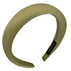 Olive green padded headband with smooth satin texture and handmade inner label detail