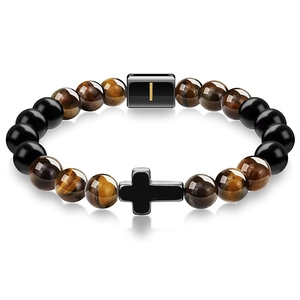 Detail of tiger eye beads bracelet with a black cross charm and magnetic clasp