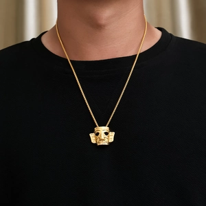 Golden Sanxingdui mask pendant on O-chain necklace worn by model showing detail